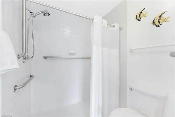 a bathroom with a shower and a shower