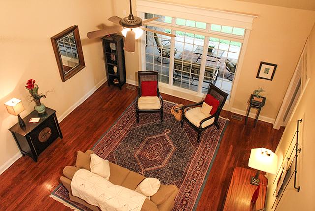 5340 Sherrington Road Murfreesboro, TN 37128 - Photo 7 of 20 Vaulted ceiling in the living room with hardwood floors and large windows with transom to view backyard.