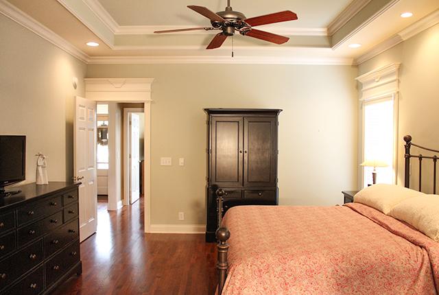 5340 Sherrington Road Murfreesboro, TN 37128 - Photo 8 of 20 Enlarged master bedroom downstairs with hardwood floor, trey ceiling, recessed lights, ceiling fan and speakers.
