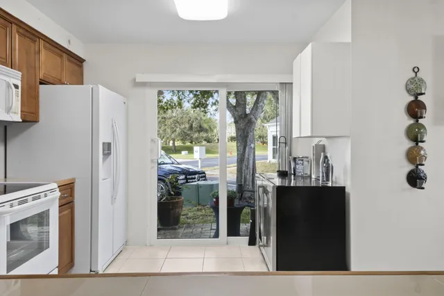 a kitchen with stainless steel appliances a refrigerator and a stove