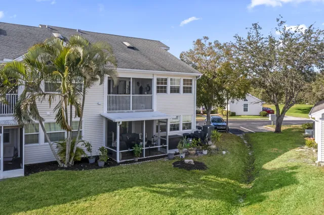 a view of a house with a yard porch and sitting area