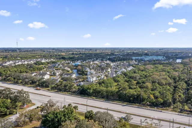 an aerial view of a residential houses with city view
