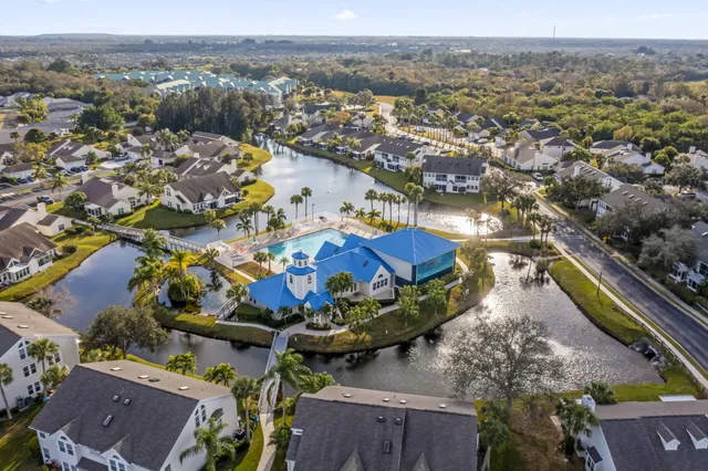 an aerial view of a house with a lake view