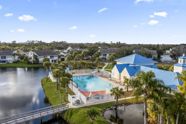 swimming pool view with a lake view
