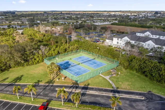 an aerial view of residential houses with outdoor space