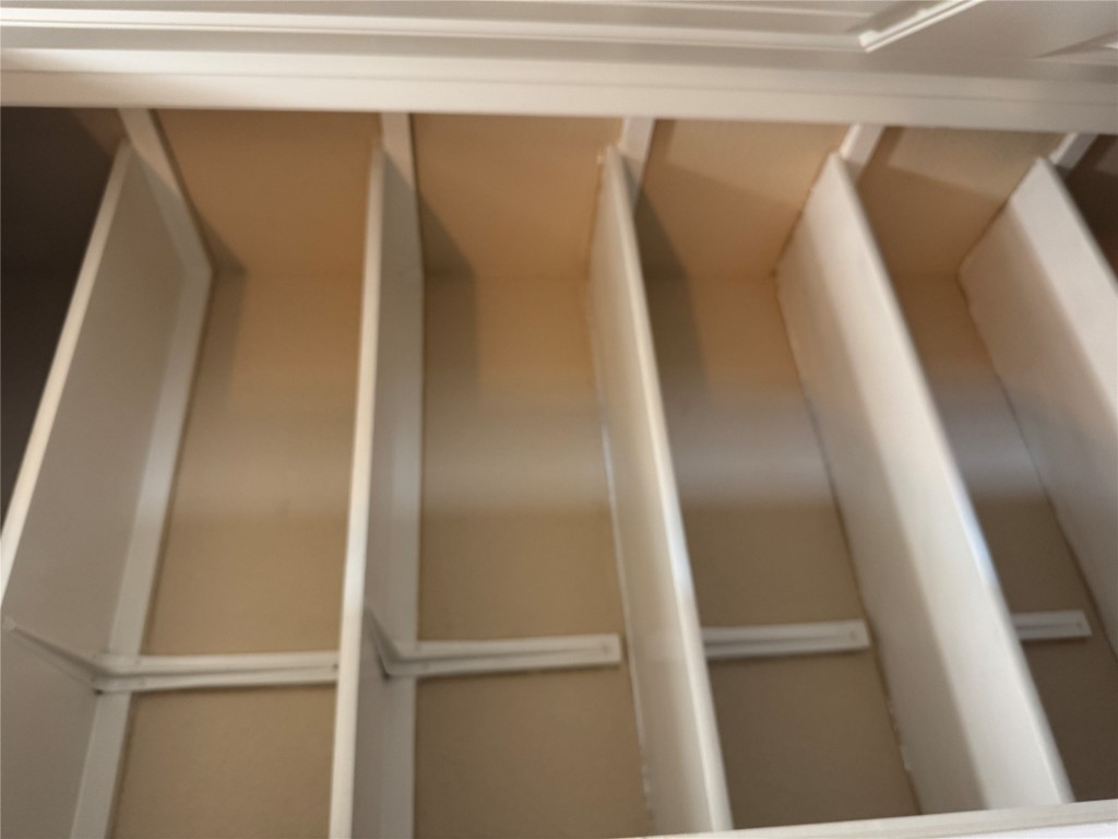 7220 Wyoming Springs Drive, Unit 1301 Round Rock, TX 78681 - Photo 11 of 21 a view of a closet with wooden floor