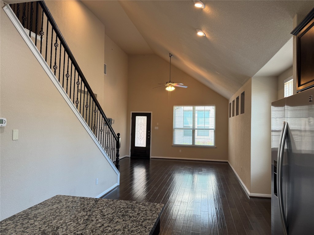 7220 Wyoming Springs Drive, Unit 1301 Round Rock, TX 78681 - Photo 7 of 21 a view of entryway with wooden floor and stairs