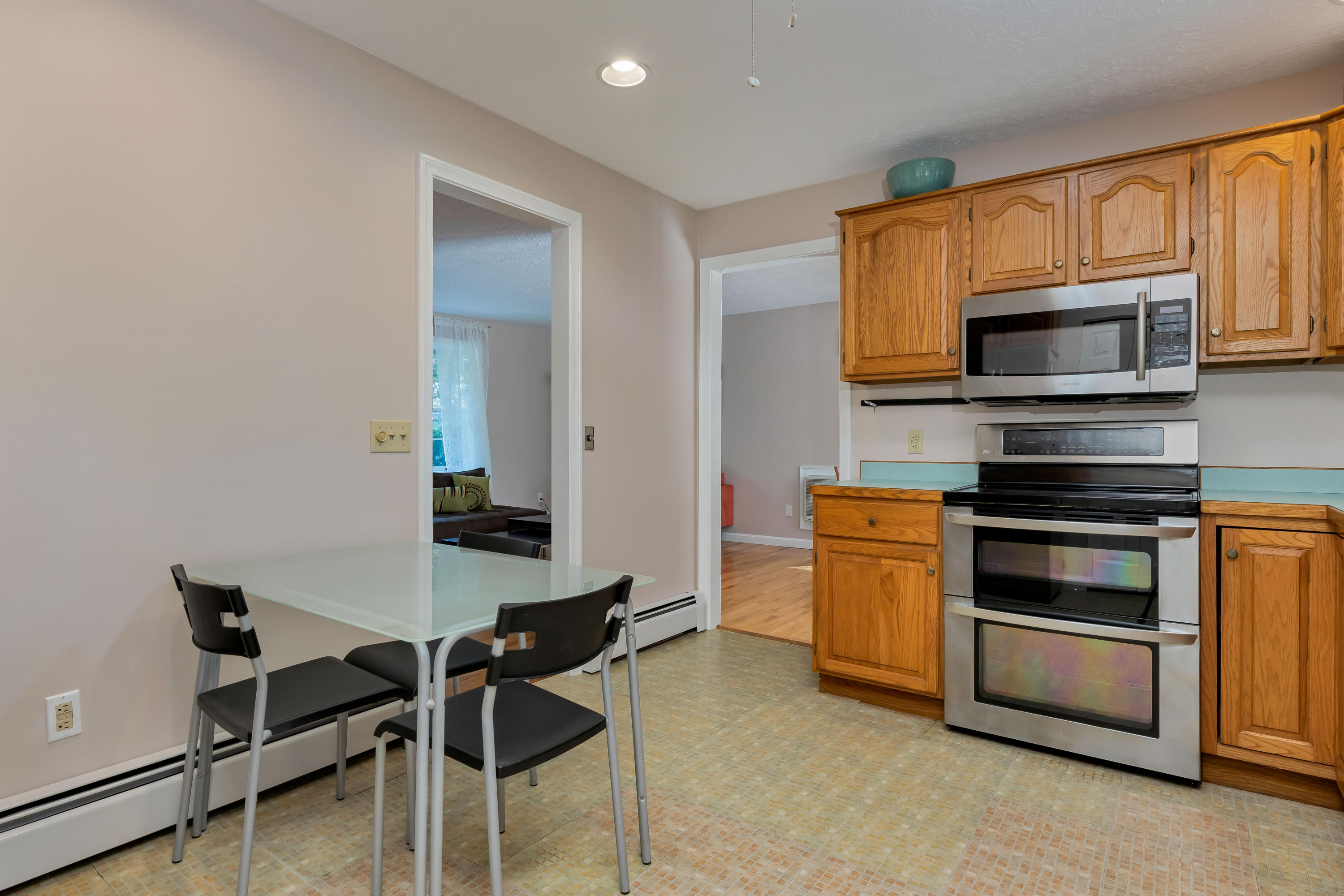 9 Green Pond Road East Falmouth, MA 02536 - Photo 12 of 46 a kitchen with a stove and a microwave