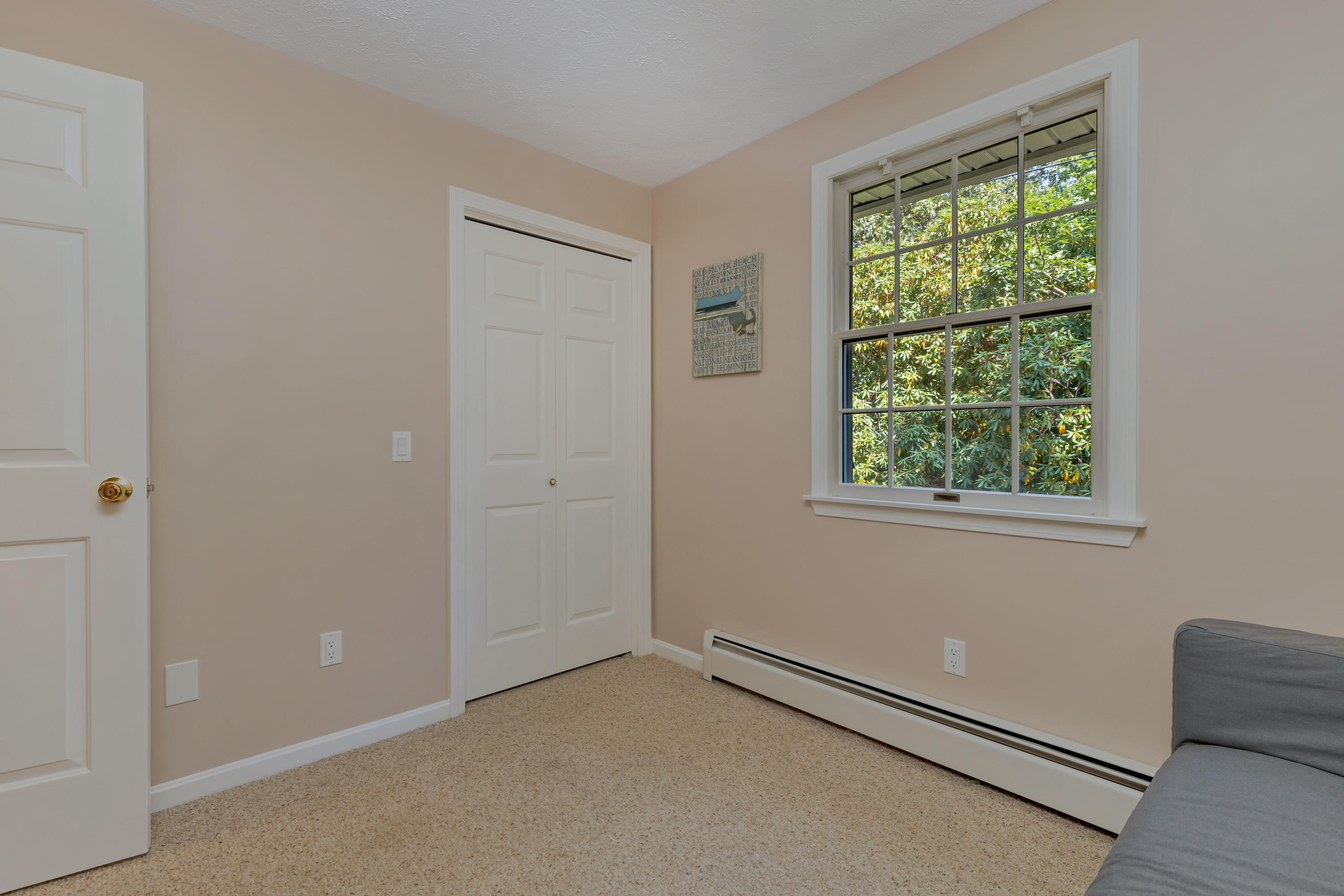 9 Green Pond Road East Falmouth, MA 02536 - Photo 15 of 46 an empty room with wooden floor and windows