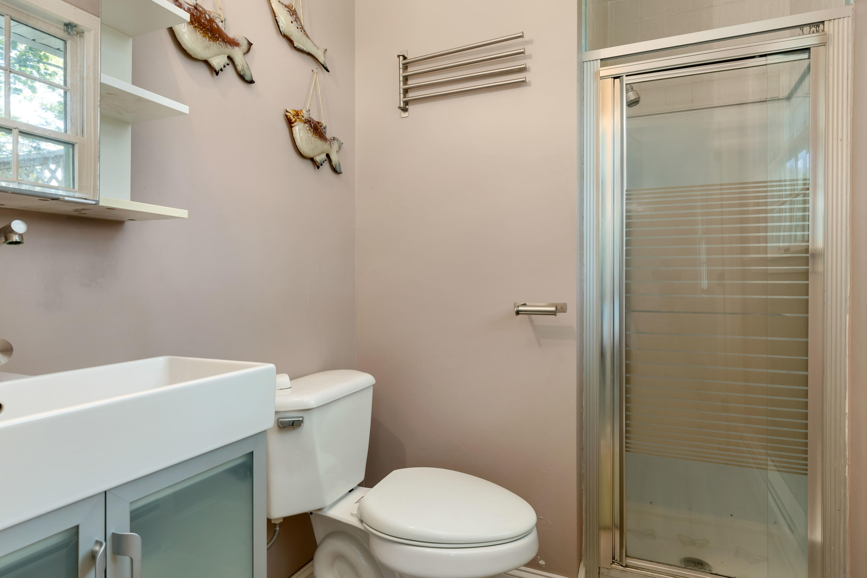 9 Green Pond Road East Falmouth, MA 02536 - Photo 21 of 46 a white toilet sitting next to a bathroom sink