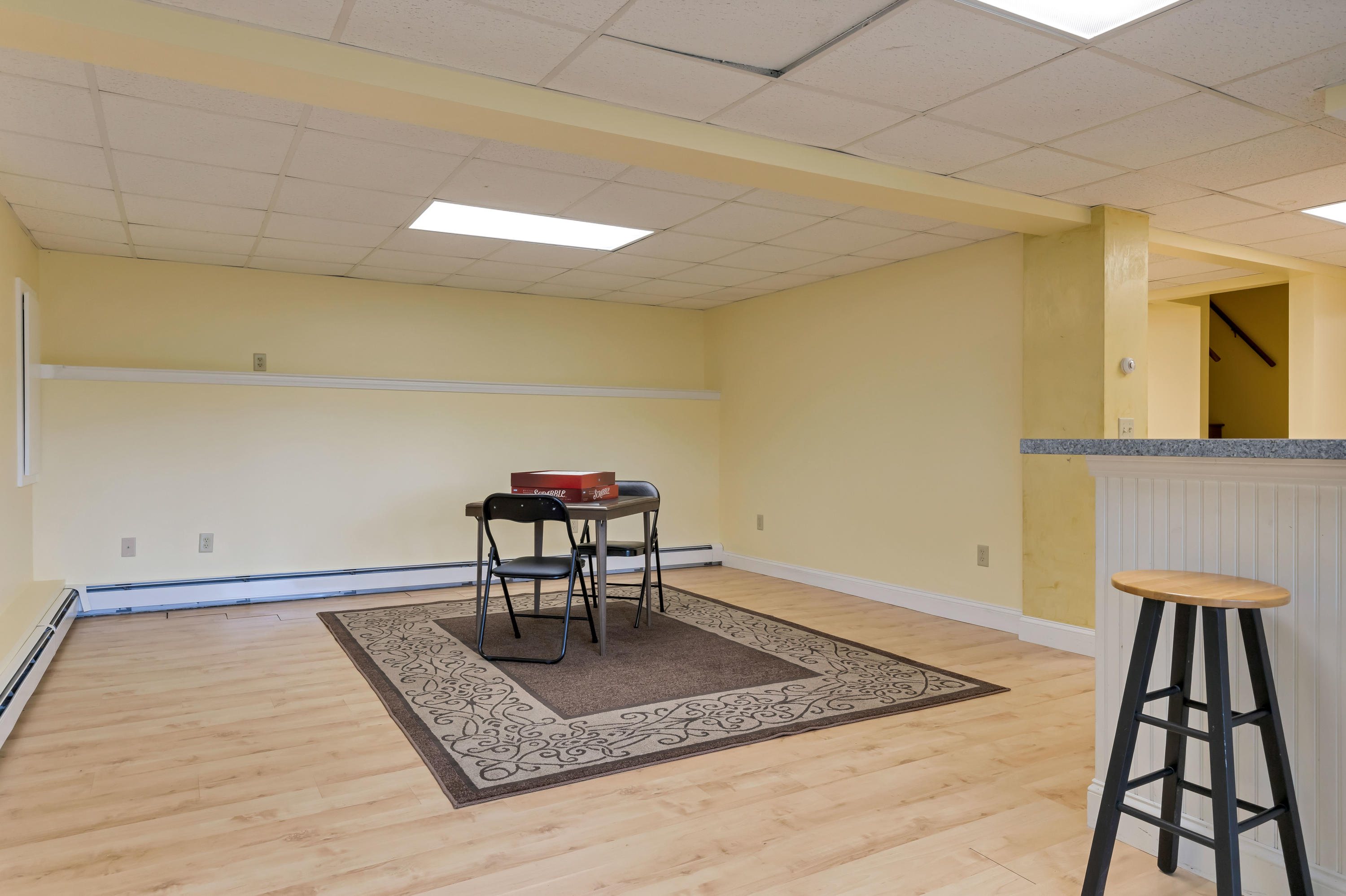 9 Green Pond Road East Falmouth, MA 02536 - Photo 25 of 46 a view of a room with wooden floor and a rug