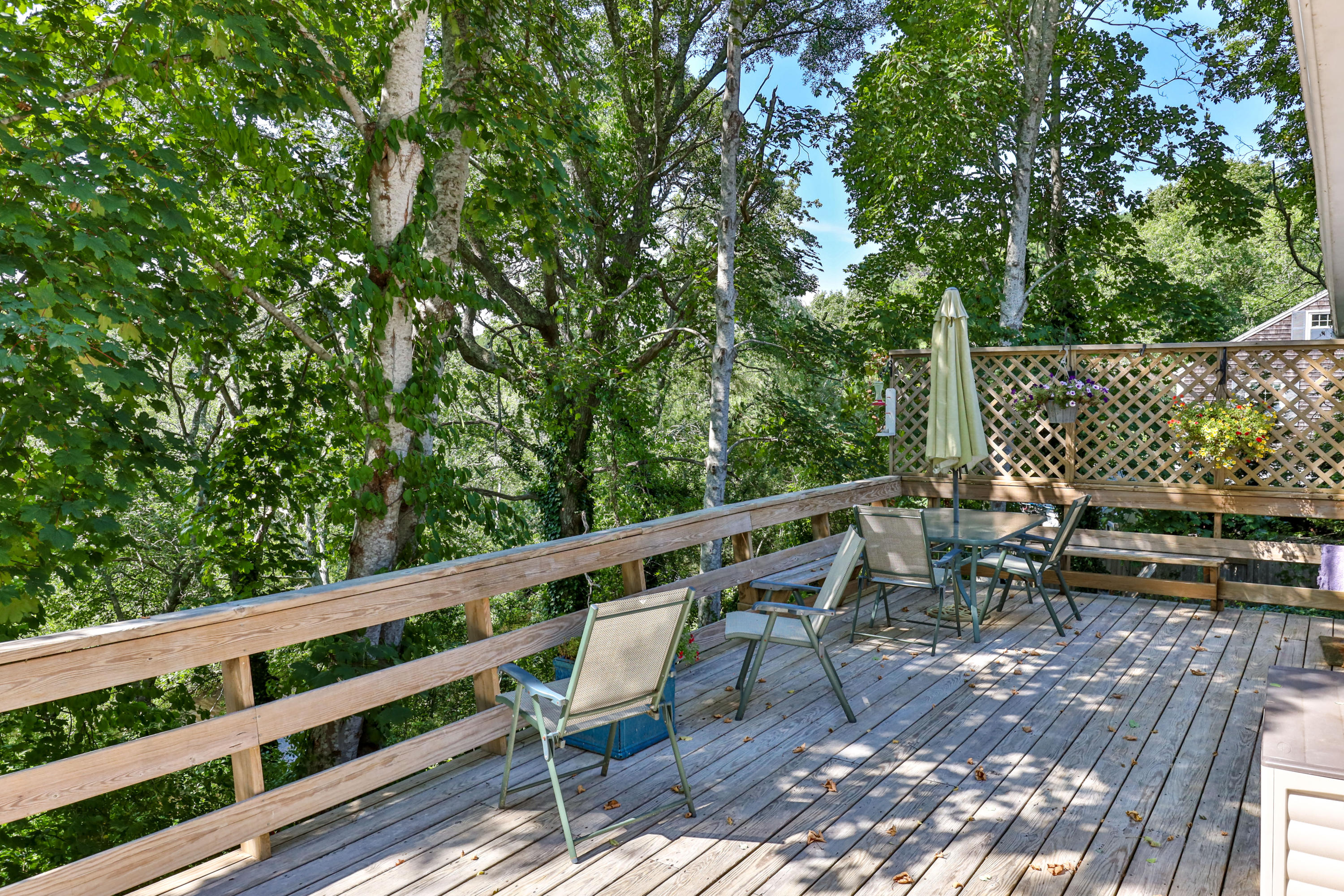 9 Green Pond Road East Falmouth, MA 02536 - Photo 31 of 46 a balcony with wooden fence and trees