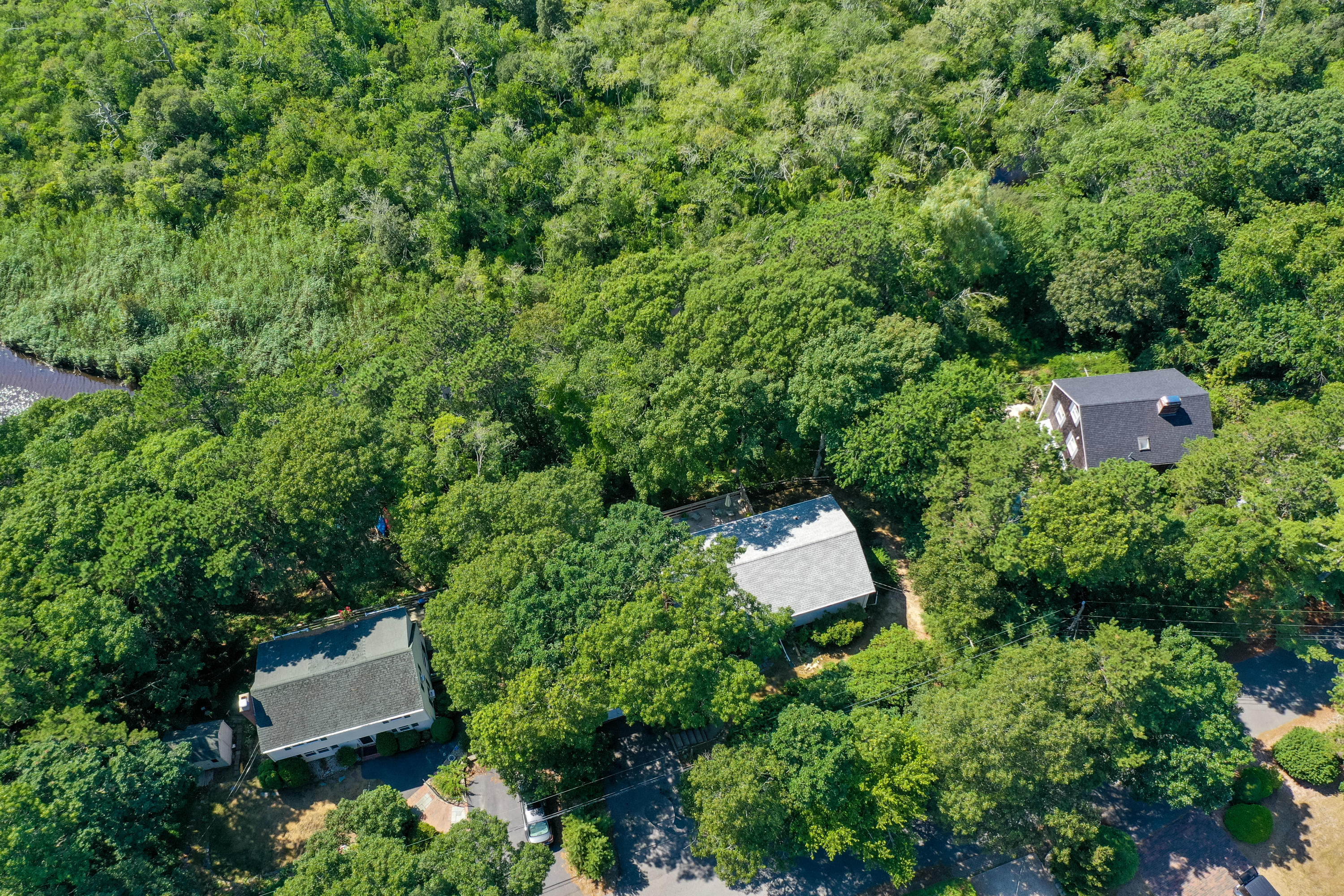 9 Green Pond Road East Falmouth, MA 02536 - Photo 37 of 46 an aerial view of a house with a yard and lake view