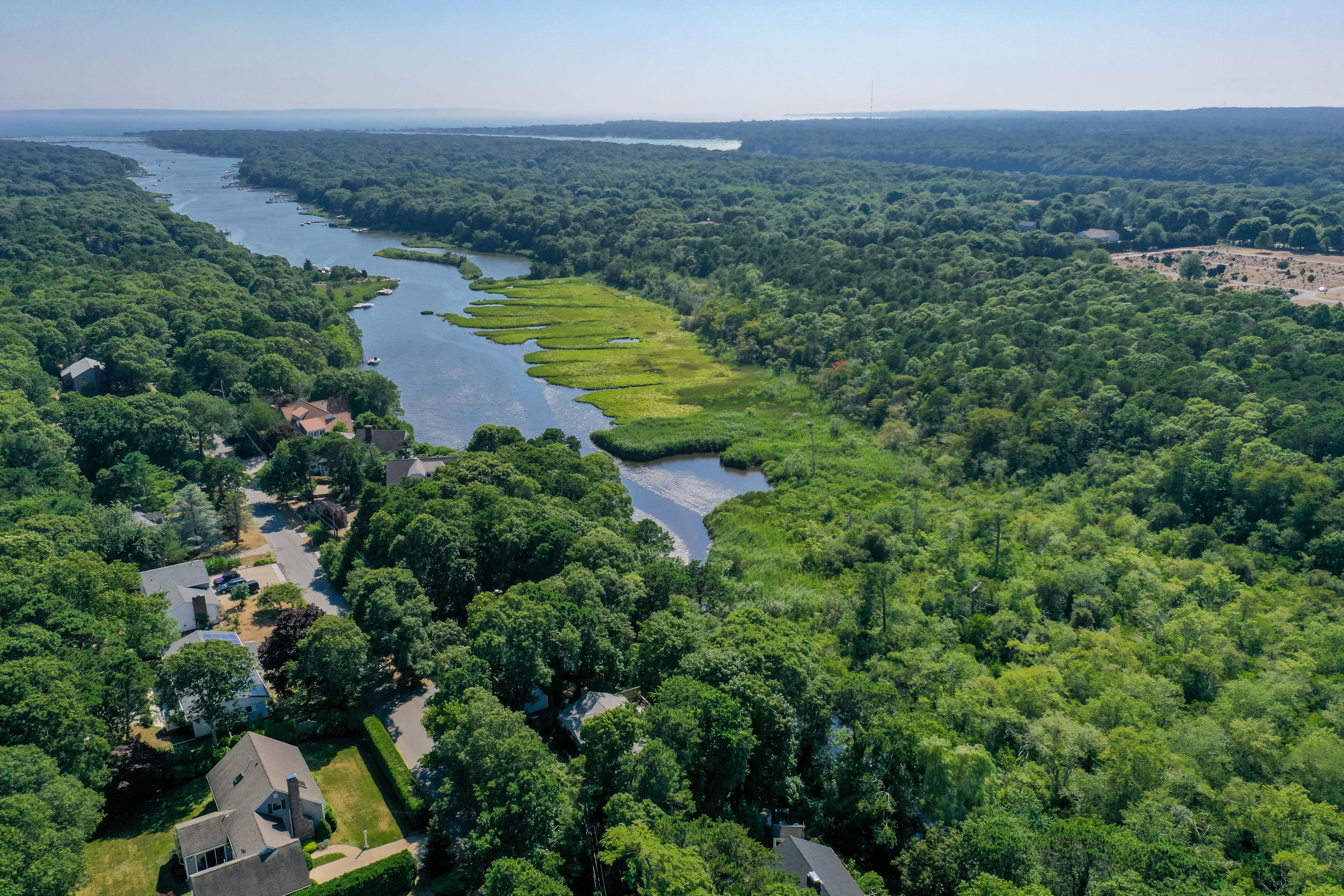 9 Green Pond Road East Falmouth, MA 02536 - Photo 40 of 46 an aerial view of residential houses with outdoor space and trees