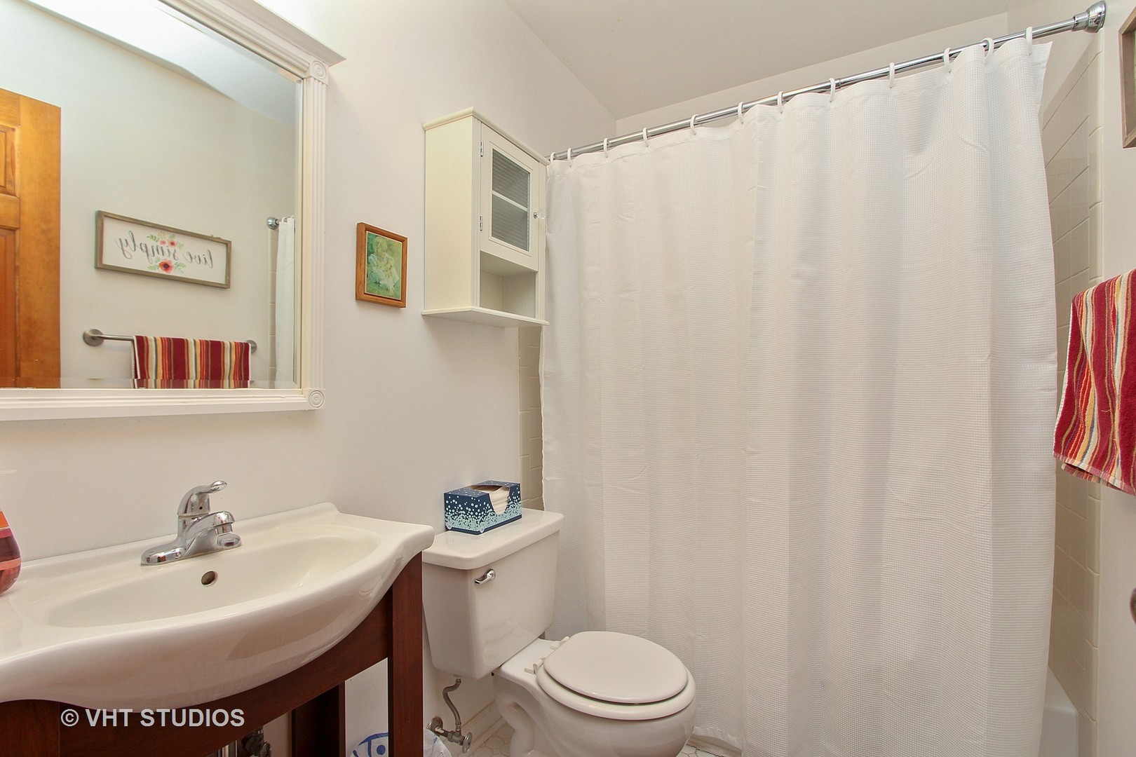 232 Foxmoor Road Fox River Grove, IL 60021 - Photo 9 of 10 a bathroom with a sink toilet and a mirror