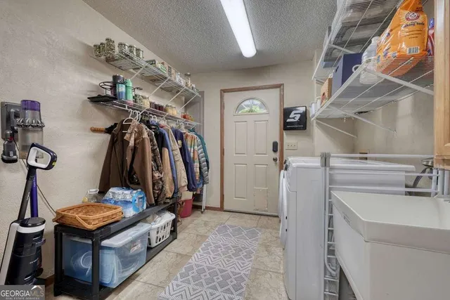 a view of livingroom with washer and dryer