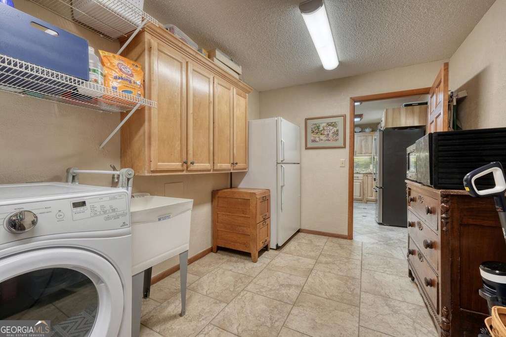 241 Kilpatrick Point Drive, Unit 8 Hayesville, NC 28904 - Photo 13 of 54 a view of livingroom with washer and dryer