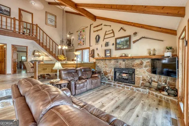 a living room with furniture and large windows