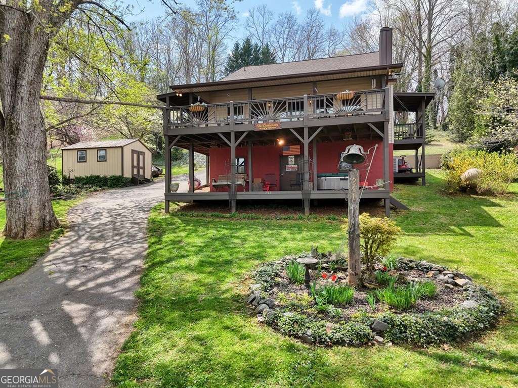 241 Kilpatrick Point Drive, Unit 8 Hayesville, NC 28904 - Photo 2 of 54 a view of a house with a yard
