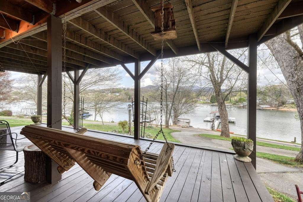 241 Kilpatrick Point Drive, Unit 8 Hayesville, NC 28904 - Photo 43 of 54 a view of a balcony with wooden floor and outdoor space