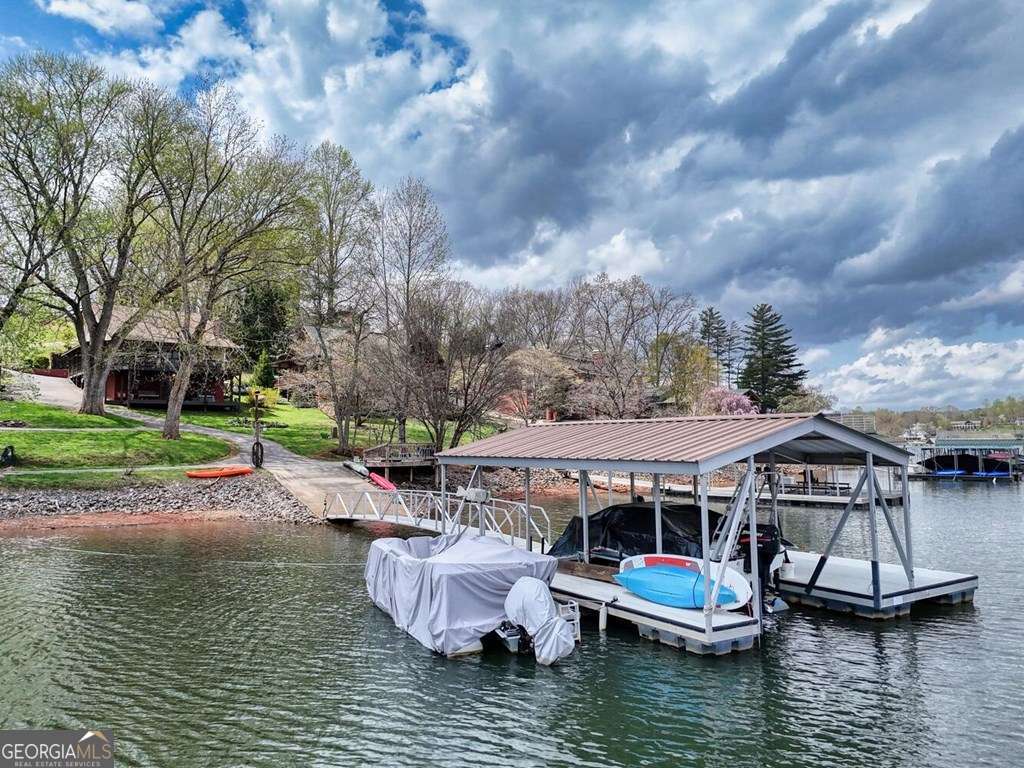241 Kilpatrick Point Drive, Unit 8 Hayesville, NC 28904 - Photo 6 of 54 a view of house with swimming pool and outdoor seating