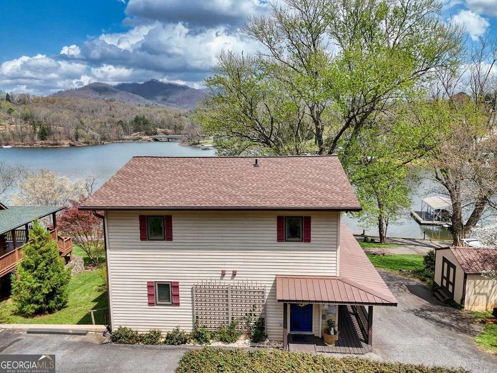 241 Kilpatrick Point Drive, Unit 8 Hayesville, NC 28904 - Photo 7 of 54 a front view of a house with a garden and tree