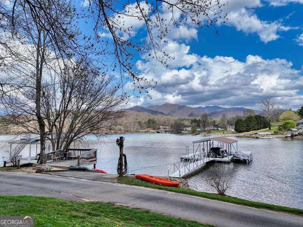 241 Kilpatrick Point Drive, Unit 8 Hayesville, NC 28904 - Photo 8 of 54 a view of a lake with houses