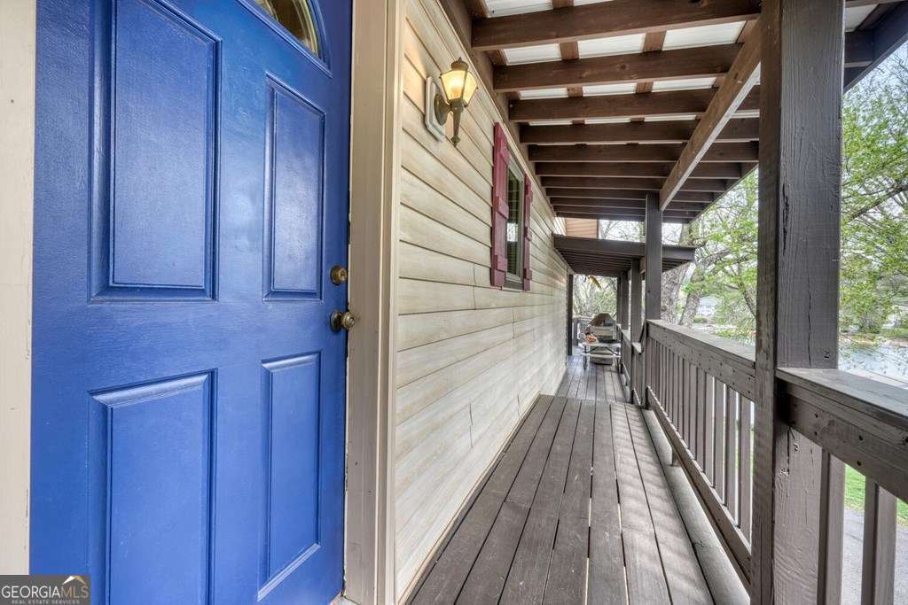 241 Kilpatrick Point Drive, Unit 8 Hayesville, NC 28904 - Photo 10 of 54 a view of balcony with wooden floor and fence