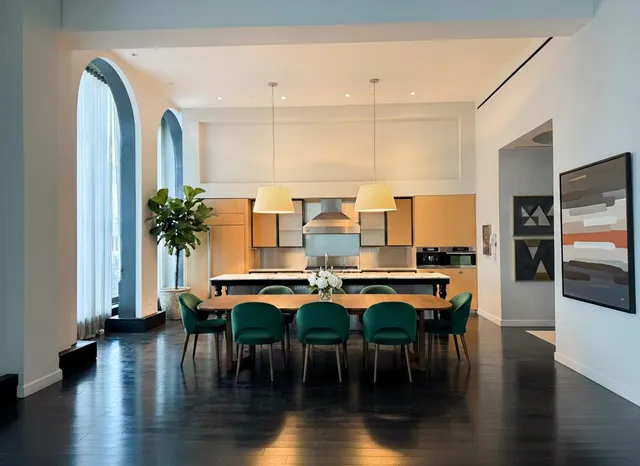 a dining room with furniture window and wooden floor