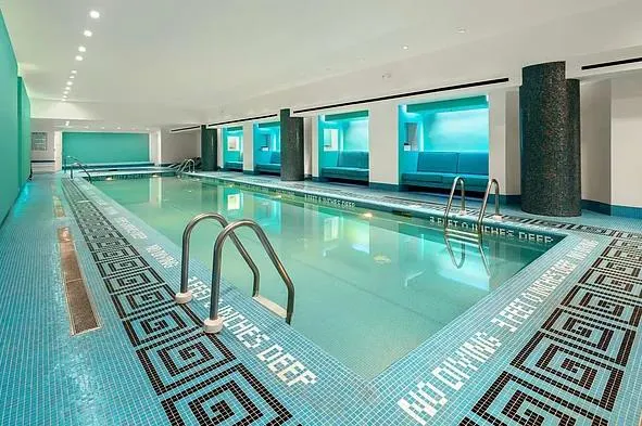 a view of a swimming pool with chairs