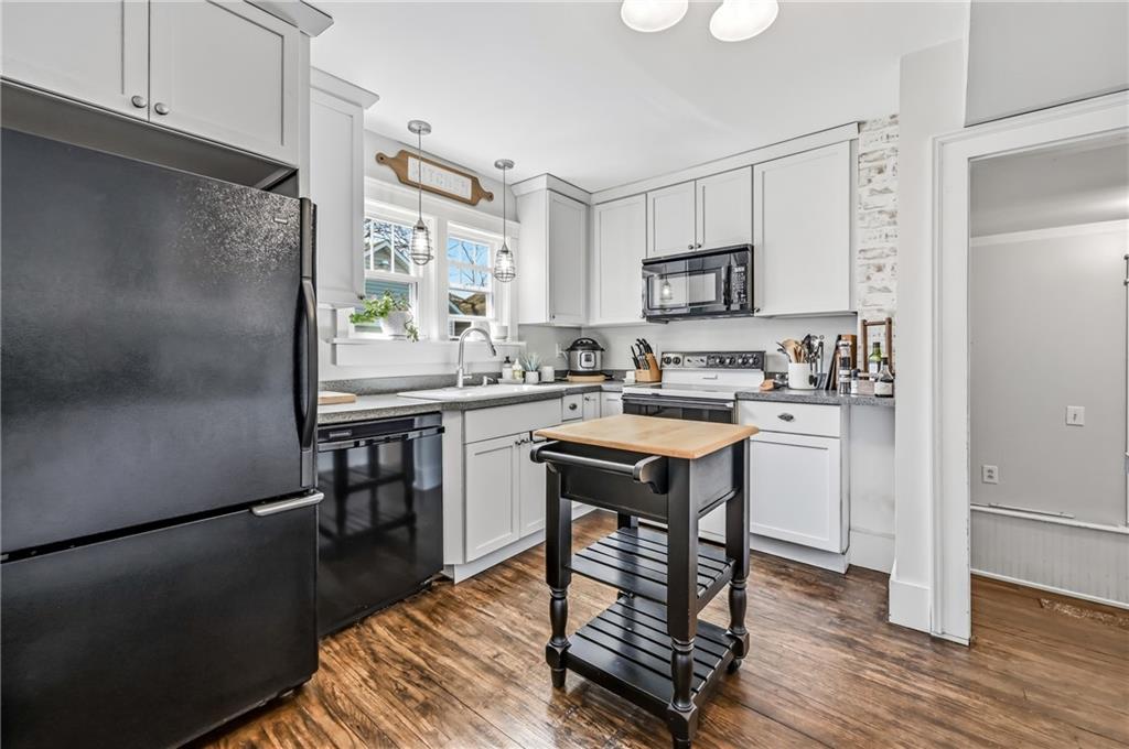 1034 Myrtle Place Sharon, PA 16146 - Photo 13 of 31 a kitchen with kitchen island a sink stove and refrigerator