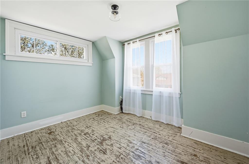 1034 Myrtle Place Sharon, PA 16146 - Photo 16 of 31 a view of a big room with wooden floor and closet
