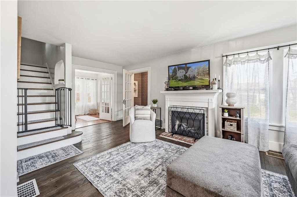 1034 Myrtle Place Sharon, PA 16146 - Photo 6 of 31 a living room with furniture a fireplace and a flat screen tv