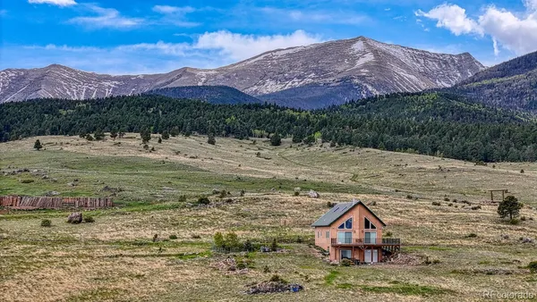 a view of a house with a mountain