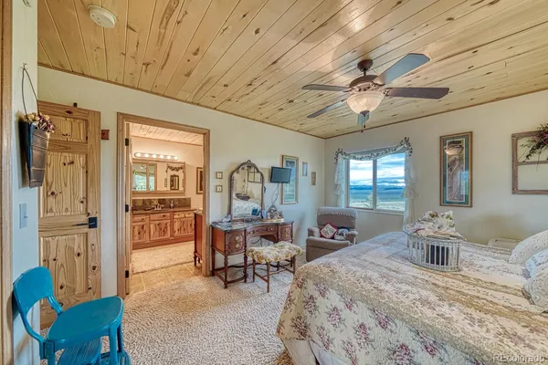 a spacious bathroom with double vanity sinks a mirror and a shower