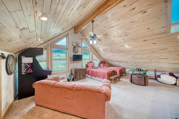 a room with lots of furniture and a rug