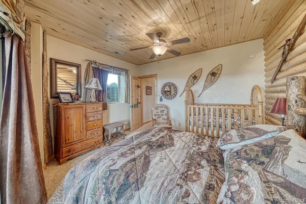a bedroom with two beds and a large mirror