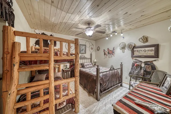 a view of roof with wooden floor and city view