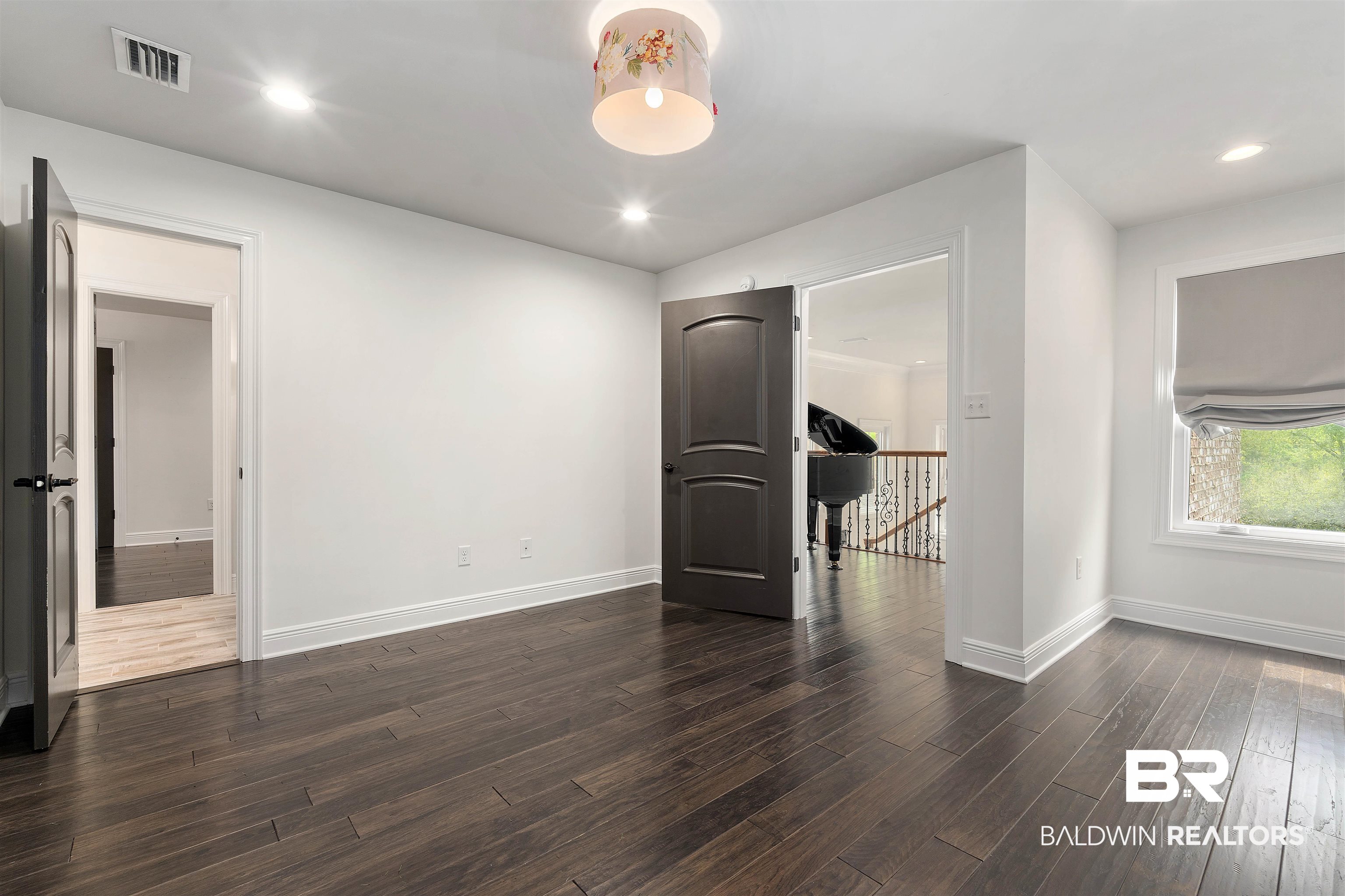 3584 Rue Royal Mobile, AL 36693 - Photo 28 of 35 Spare room with dark wood-style floors, visible vents, recessed lighting, and baseboards