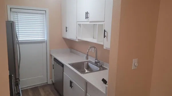 a bathroom with a sink and washing machine