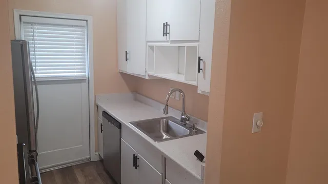 a bathroom with a sink and washing machine