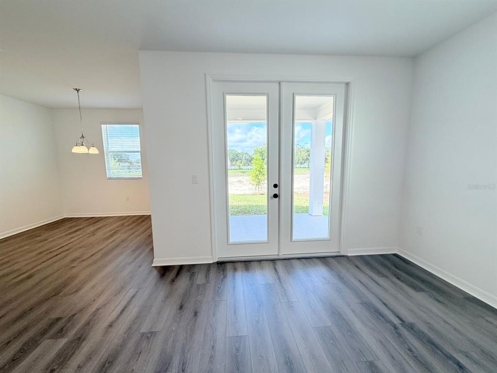 30155 Rustic Mill St Mount Mount Dora, FL 32757 - Photo 11 of 20 an empty room with wooden floor and windows