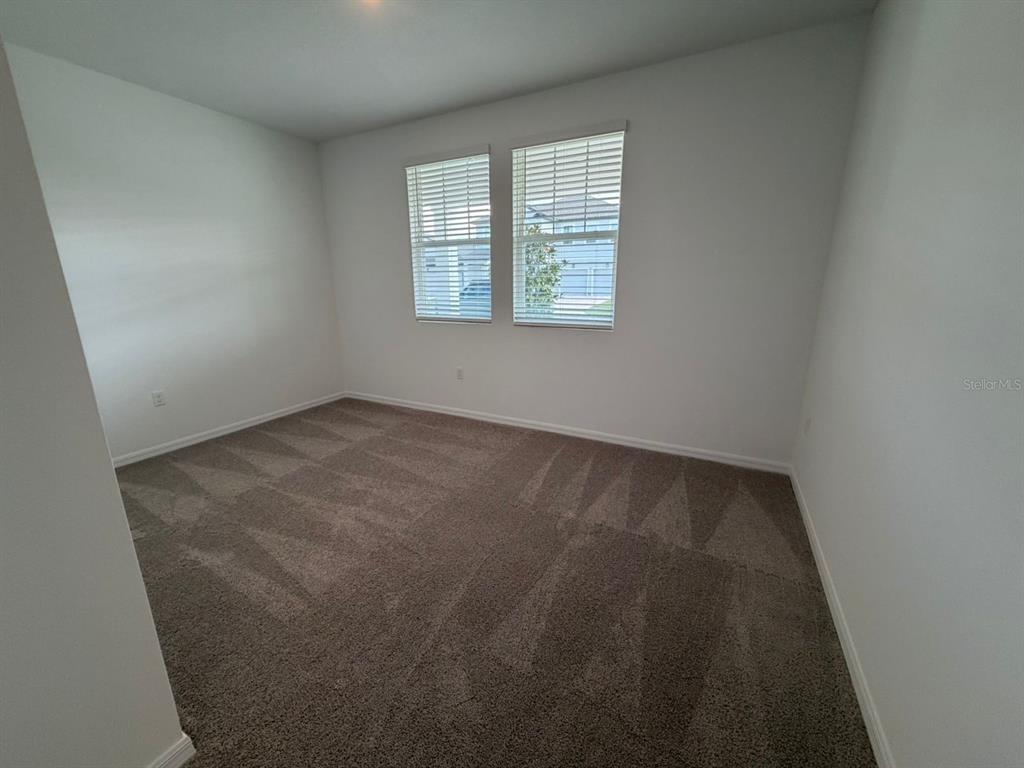30155 Rustic Mill St Mount Mount Dora, FL 32757 - Photo 7 of 20 an empty room with windows