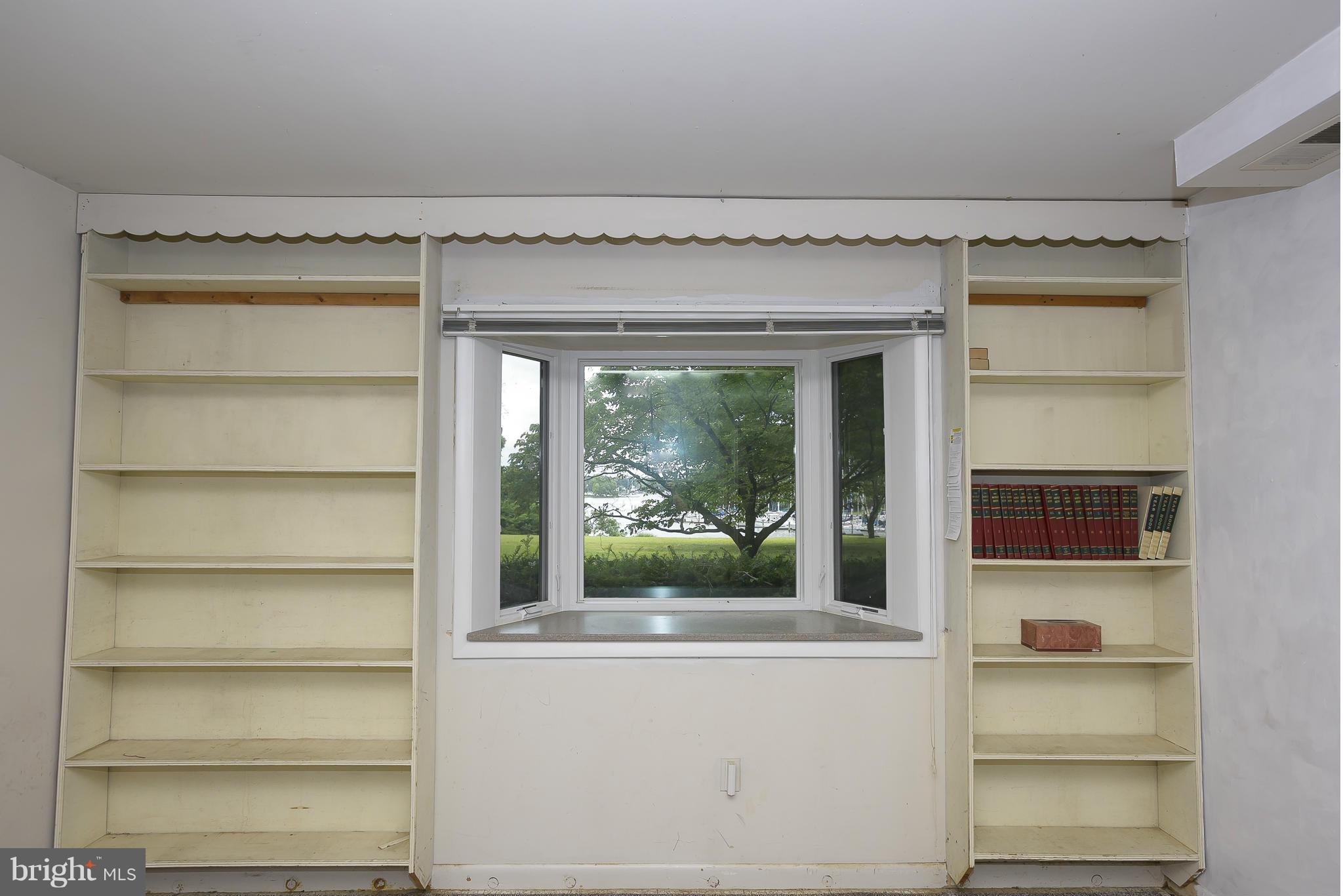 1322 River Road Pasadena, MD 21122 - Photo 11 of 25 Family Room has built-ins & garden window.