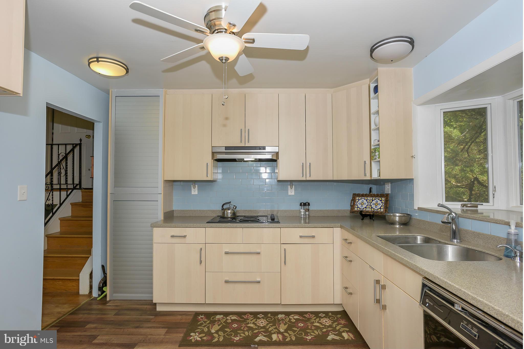 Kitchen has a ceiling fan.