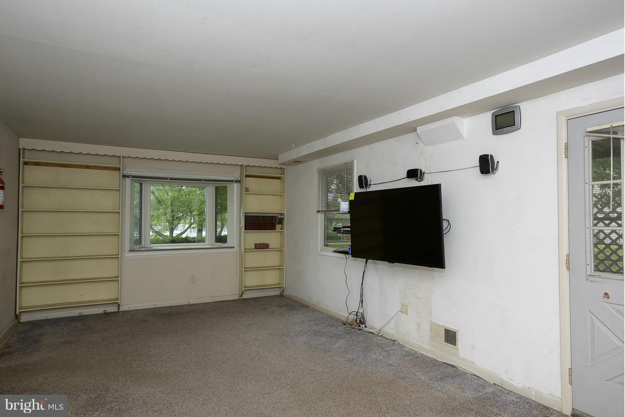 1322 River Road Pasadena, MD 21122 - Photo 9 of 25 Family Room leads to screened porch.