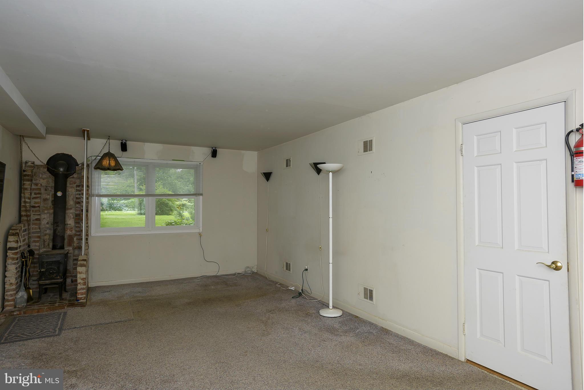 1322 River Road Pasadena, MD 21122 - Photo 10 of 25 Family Room has a wood stove.