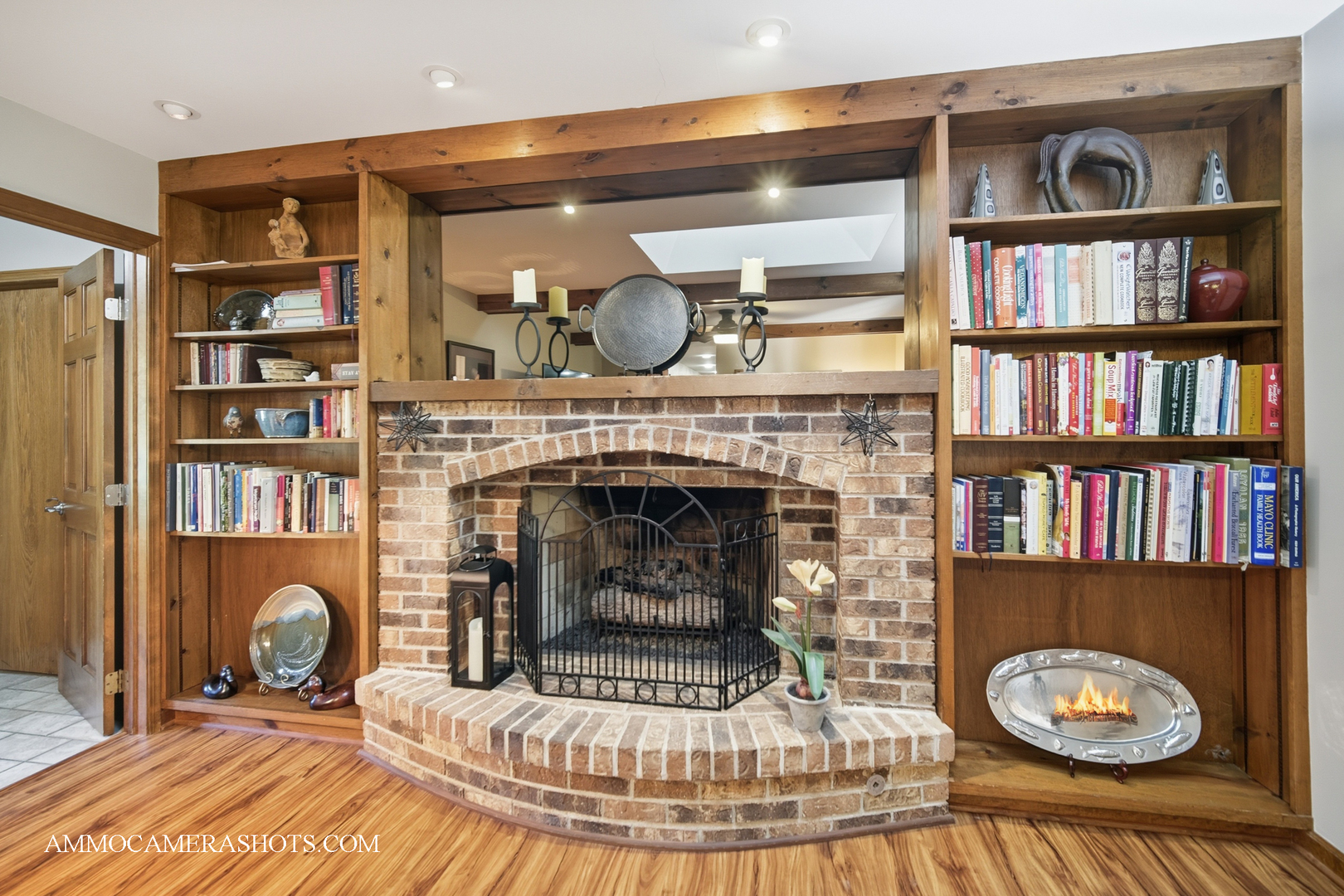 12 Highgate Court St. Charles, IL 60174 - Photo 22 of 60 a living room with bookshelf and a fireplace