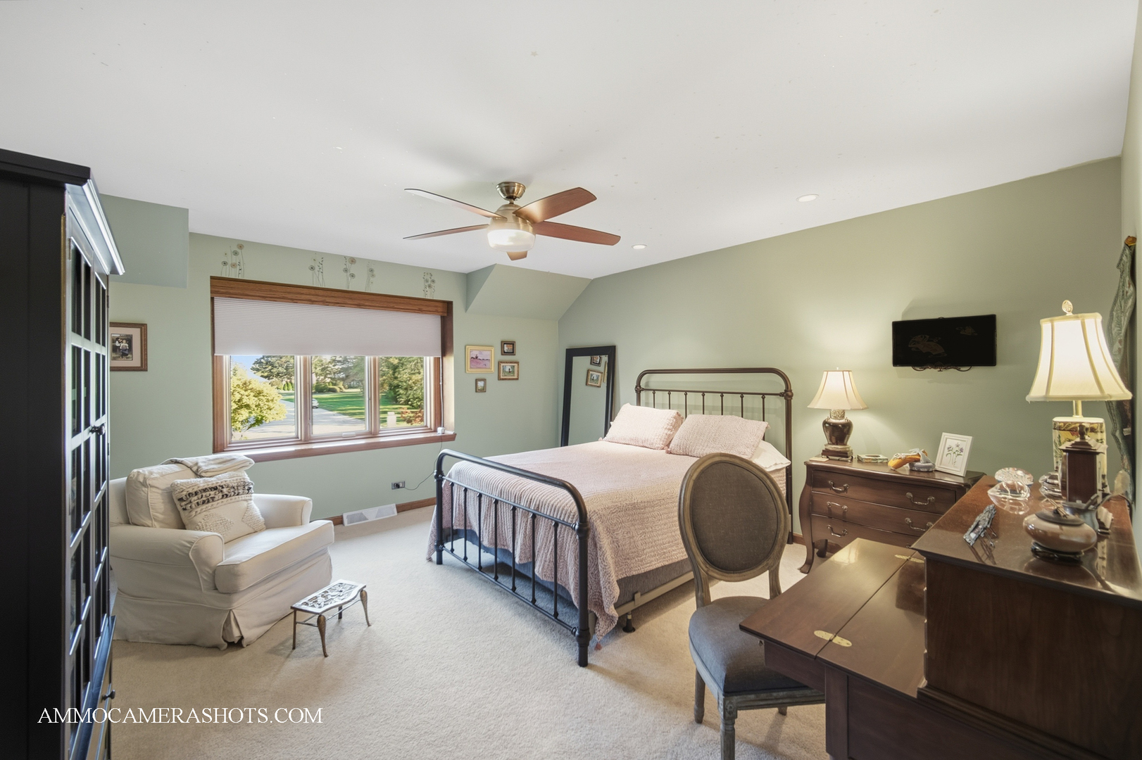 12 Highgate Court St. Charles, IL 60174 - Photo 27 of 60 a spacious bedroom with a bed and a chandelier