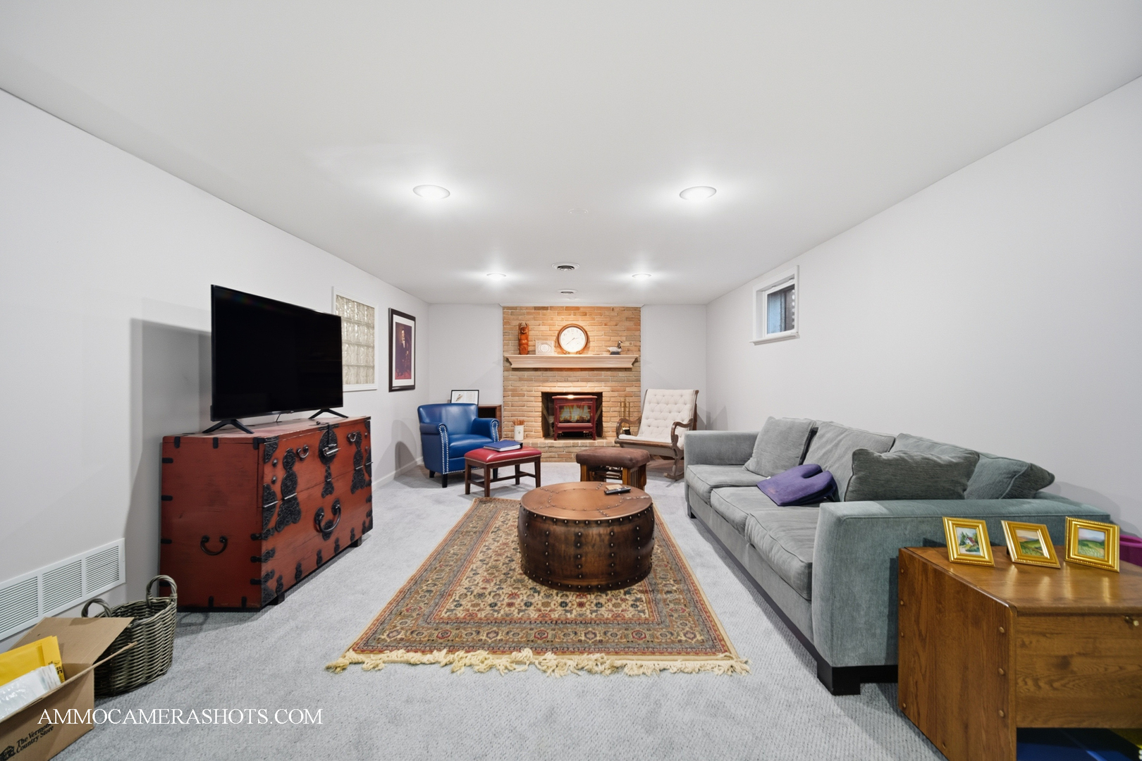 12 Highgate Court St. Charles, IL 60174 - Photo 37 of 60 a living room with furniture and a flat screen tv